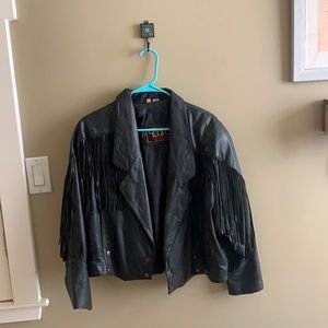 Oversized black leather jacket with fringe